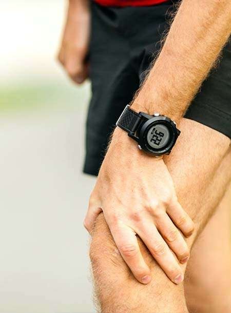 Man wearing digital sports watch on wrist