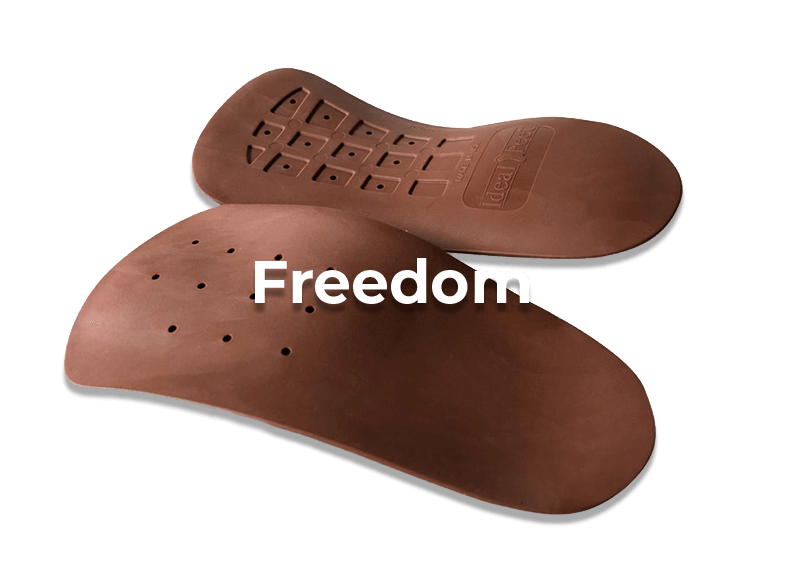 Brown orthotic insoles with 'Freedom' text branding