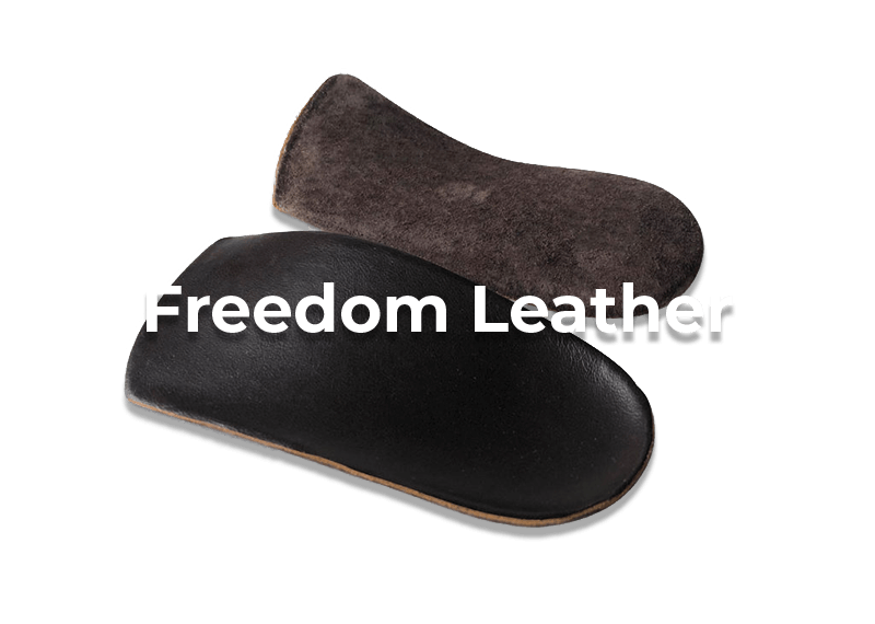 Brown 'Freedom Leather' orthotic insoles on black background