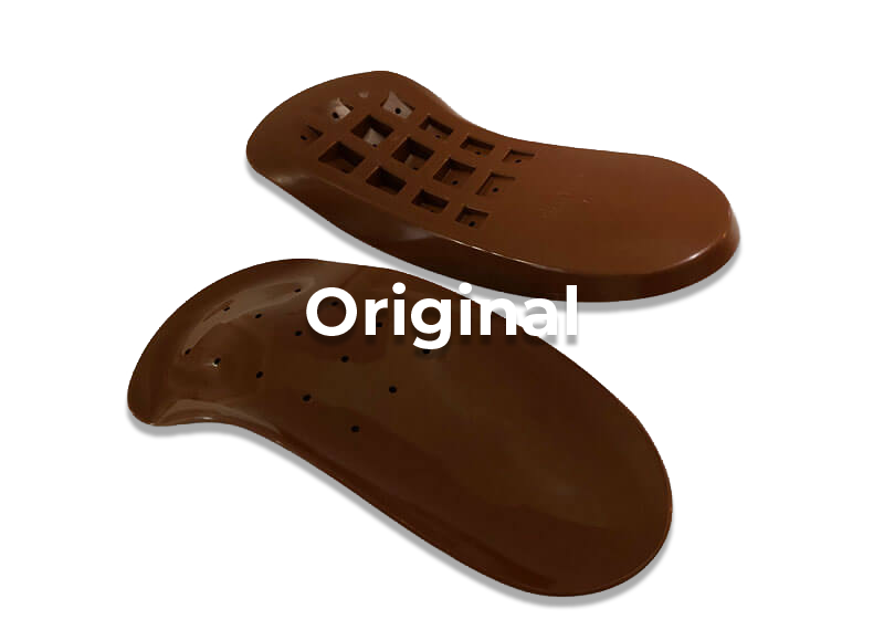 Two brown orthotic shoe insoles isolated on white